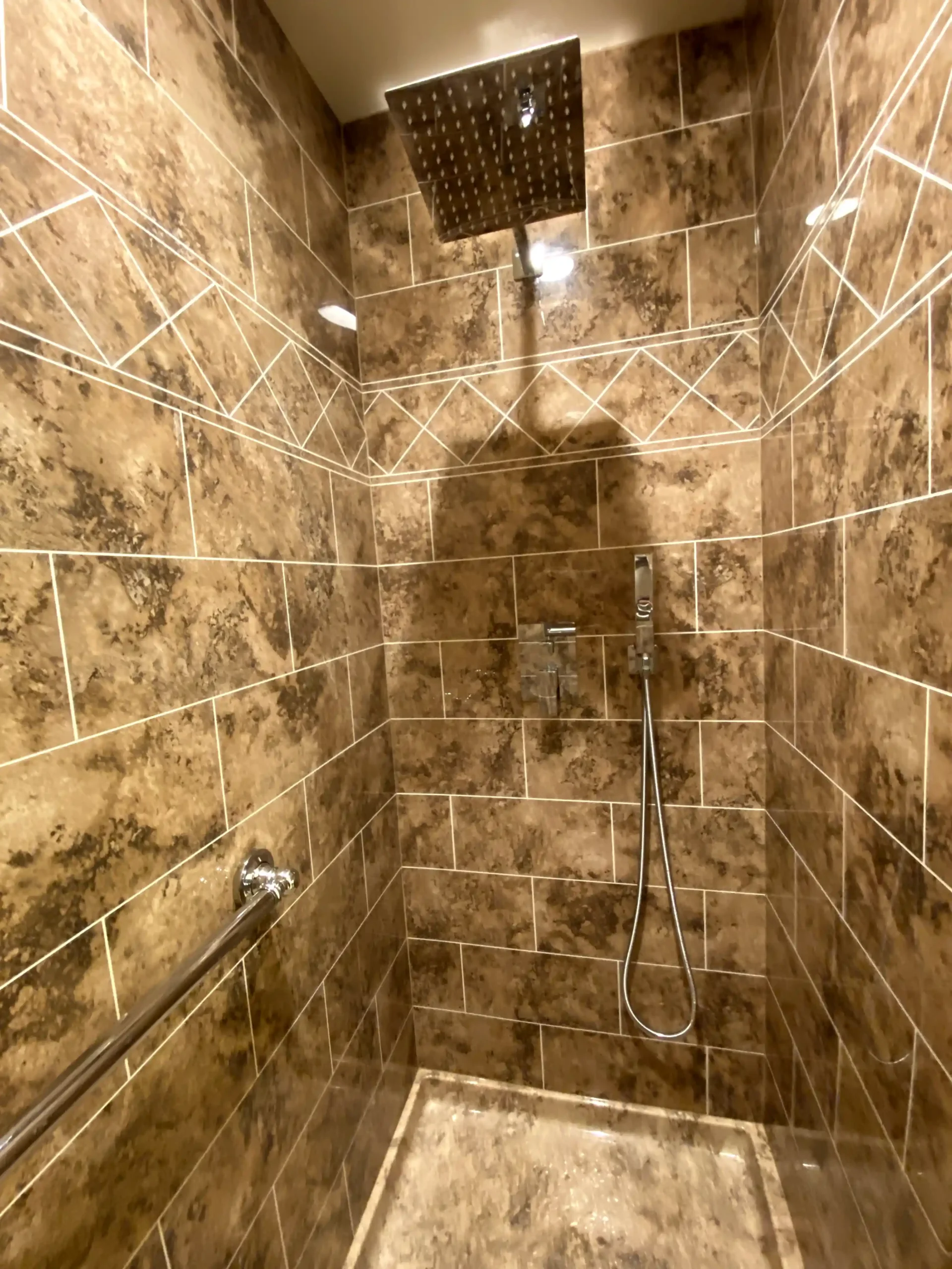 Bathroom remodel installation in Sacramento with new shower walls, vanity, flooring, and fixture updates in progress.